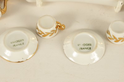 Lot 47 - AN EARLY 20TH CENTURY MINIATURE LIMOGES PORCELAIN FRENCH NAPOLEON TEA SERVICE