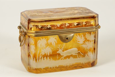 Lot 14 - A 19TH CENTURY BOHEMIAN AMBER GLASS OVERLAY CASKET