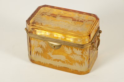Lot 14 - A 19TH CENTURY BOHEMIAN AMBER GLASS OVERLAY CASKET