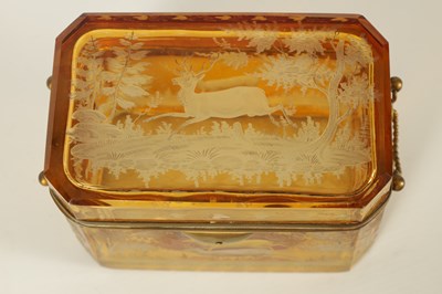 Lot 14 - A 19TH CENTURY BOHEMIAN AMBER GLASS OVERLAY CASKET