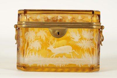 Lot 14 - A 19TH CENTURY BOHEMIAN AMBER GLASS OVERLAY CASKET