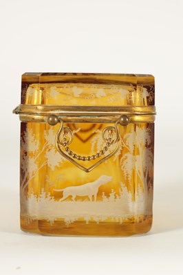 Lot 14 - A 19TH CENTURY BOHEMIAN AMBER GLASS OVERLAY CASKET