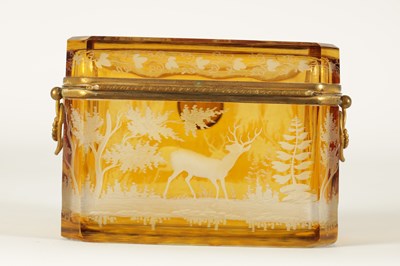 Lot 14 - A 19TH CENTURY BOHEMIAN AMBER GLASS OVERLAY CASKET