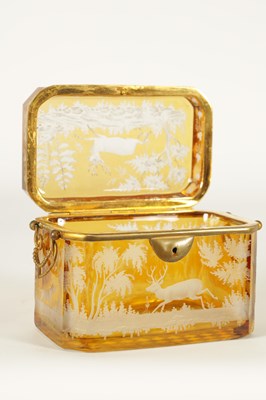Lot 14 - A 19TH CENTURY BOHEMIAN AMBER GLASS OVERLAY CASKET