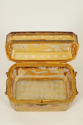 Lot 14 - A 19TH CENTURY BOHEMIAN AMBER GLASS OVERLAY CASKET