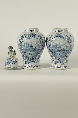 Lot 36 - A PAIR OF 18TH CENTURY BLUE AND WHITE DELFT VASES AND COVER