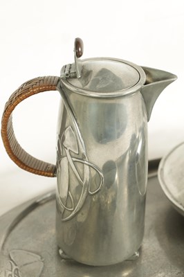 Lot 569 - AN EARLY 20TH CENTURY ARCHIBALD KNOX FOR LIBERTY AND CO. TUDRIC PEWTER TEA SET