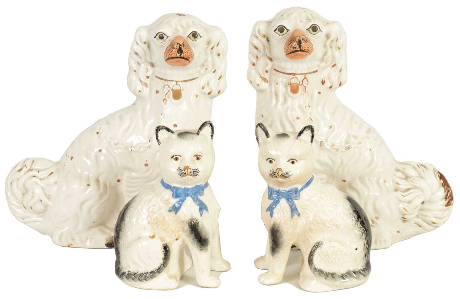 Lot 45 - A LARGE PAIR OF VICTORIAN SEATED STAFFORDSHIRE DOGS together with A PAIR OF SEATED MODELS OF CATS