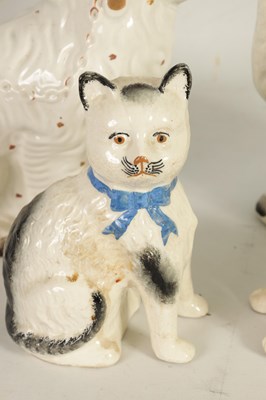 Lot 45 - A LARGE PAIR OF VICTORIAN SEATED STAFFORDSHIRE DOGS together with A PAIR OF SEATED MODELS OF CATS