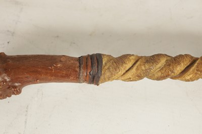 Lot 484 - TWO MASK HEAD CARVED WOOD WALKING STICKS AND A RIDING CROP