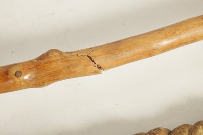 Lot 484 - TWO MASK HEAD CARVED WOOD WALKING STICKS AND A RIDING CROP