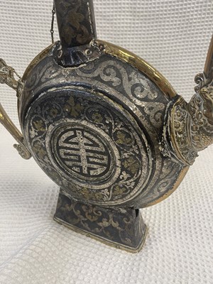 Lot 99 - A RARE 17TH/18TH CENTURY TIBETAN IRON AND MIXED METAL INLAID CHAANG FLASK