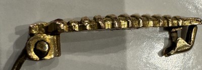 Lot 821 - A RARE WW2 GOLD CATERPILLAR CLUB BADGE WITH RUBY EYES AWARDED TO SERGEANT S.J. HARDING