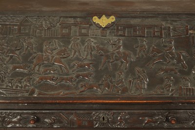 Lot 835 - A GEORGE III CARVED OAK BUREAU