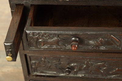 Lot 835 - A GEORGE III CARVED OAK BUREAU