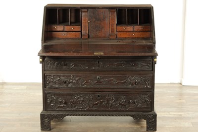 Lot 835 - A GEORGE III CARVED OAK BUREAU