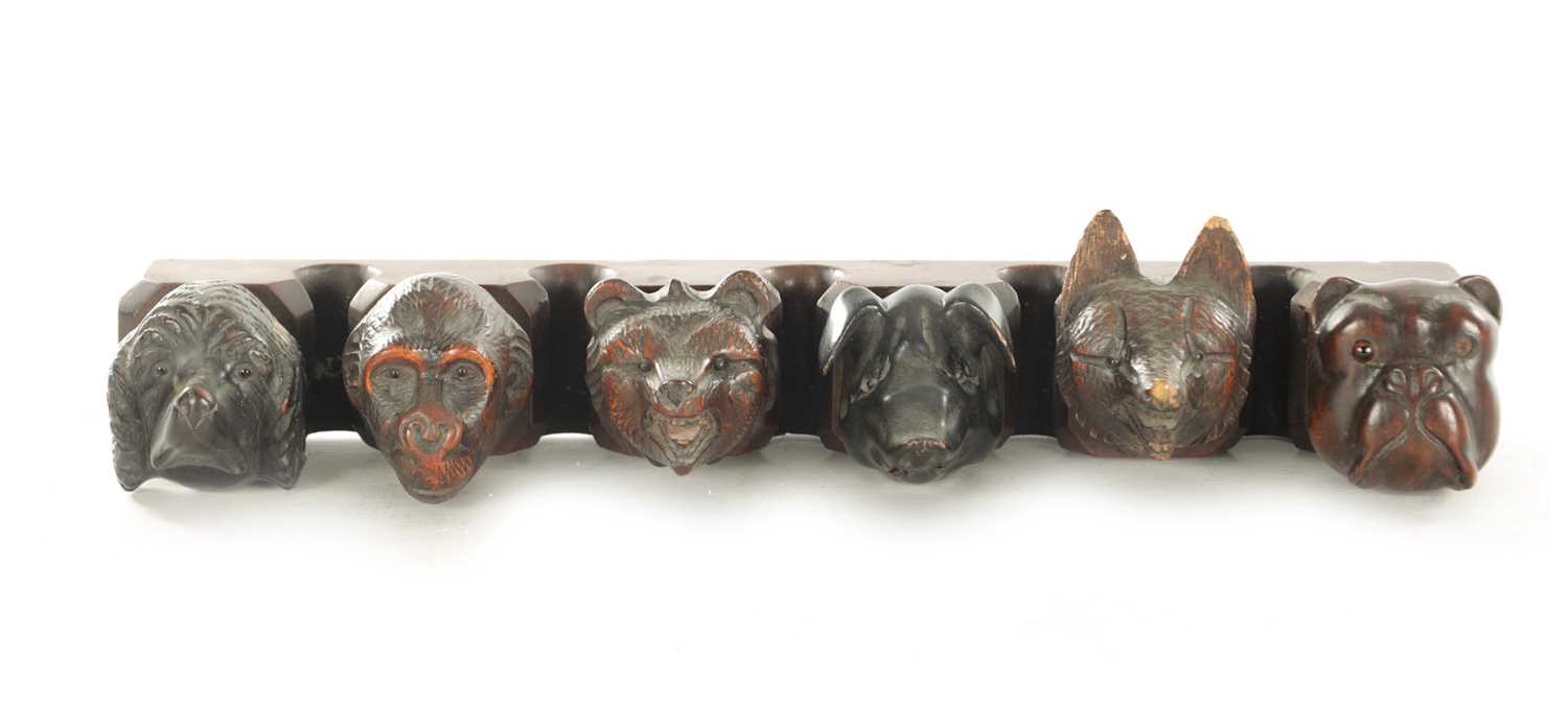 Lot 1172 - A 19TH CENTURY CARVED BLACK FOREST PIPE RACK