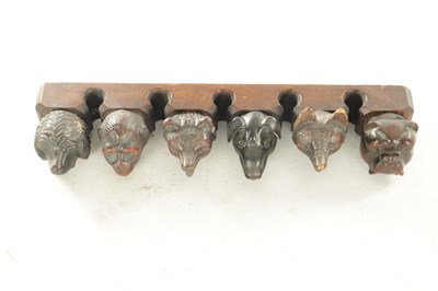 Lot 1172 - A 19TH CENTURY CARVED BLACK FOREST PIPE RACK