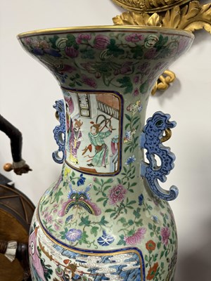 Lot 120 - AN IMPRESSIVE PAIR OF 19TH CENTURY CANTONESE CELADON GROUND AND FAMILLE ROSE HALL VASES ON LATE REGENCY ROSEWOOD STANDS