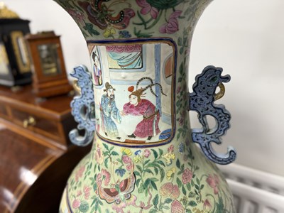 Lot 120 - AN IMPRESSIVE PAIR OF 19TH CENTURY CANTONESE CELADON GROUND AND FAMILLE ROSE HALL VASES ON LATE REGENCY ROSEWOOD STANDS