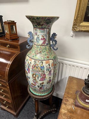 Lot 120 - AN IMPRESSIVE PAIR OF 19TH CENTURY CANTONESE CELADON GROUND AND FAMILLE ROSE HALL VASES ON LATE REGENCY ROSEWOOD STANDS