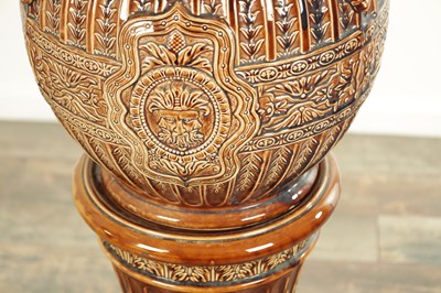 Lot 29 - A 19TH CENTURY TREACLE GLAZED MAJOLICA JARDINIERE ON STAND