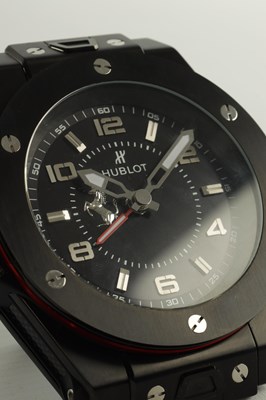 Lot 976 - A BLACK STEEL HUBLOT BIG BANG FERRARI DESK CLOCK