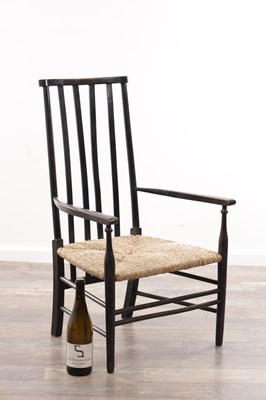 Lot 1301 - AN EARLY 20TH CENTURY EBONISED WOOD SUSSEX ARMCHAIR