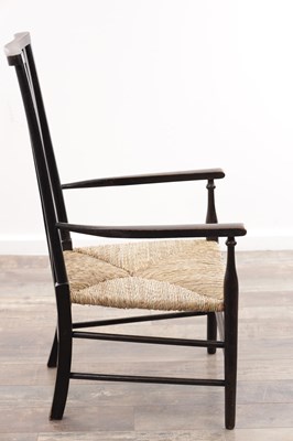 Lot 1301 - AN EARLY 20TH CENTURY EBONISED WOOD SUSSEX ARMCHAIR