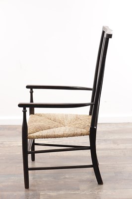 Lot 1301 - AN EARLY 20TH CENTURY EBONISED WOOD SUSSEX ARMCHAIR