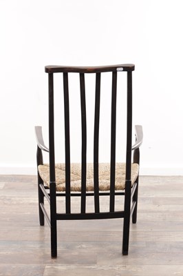 Lot 1301 - AN EARLY 20TH CENTURY EBONISED WOOD SUSSEX ARMCHAIR