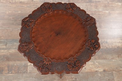 Lot 108 - A 19TH CENTURY ANGLO-INDIAN CARVED HARDWOOD FOLDING SIDE TABLE