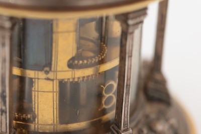 Lot 1243 - AN EARLY 17TH CENTURY SILVER AND GILT PENDULE A CERCLES TOURNANTS CLOCK WITH FIGURAL FINIAL