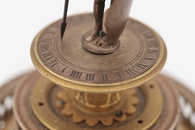 Lot 1243 - AN EARLY 17TH CENTURY SILVER AND GILT PENDULE A CERCLES TOURNANTS CLOCK WITH FIGURAL FINIAL