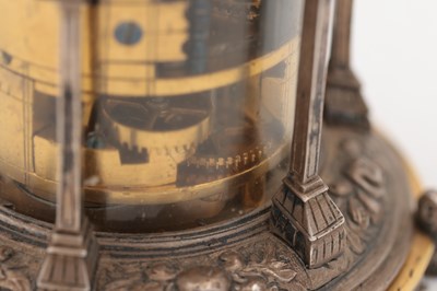 Lot 1243 - AN EARLY 17TH CENTURY SILVER AND GILT PENDULE A CERCLES TOURNANTS CLOCK WITH FIGURAL FINIAL