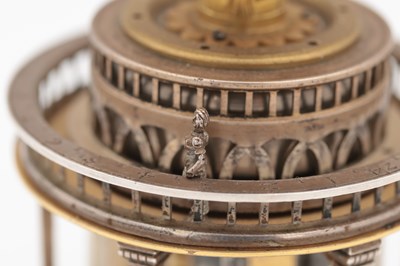Lot 1243 - AN EARLY 17TH CENTURY SILVER AND GILT PENDULE A CERCLES TOURNANTS CLOCK WITH FIGURAL FINIAL