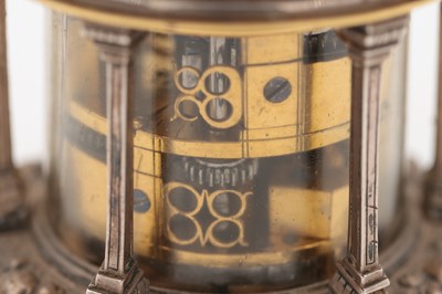 Lot 1243 - AN EARLY 17TH CENTURY SILVER AND GILT PENDULE A CERCLES TOURNANTS CLOCK WITH FIGURAL FINIAL