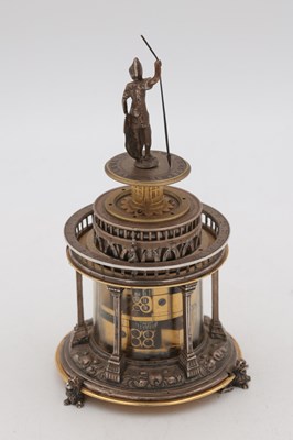 Lot 1243 - AN EARLY 17TH CENTURY SILVER AND GILT PENDULE A CERCLES TOURNANTS CLOCK WITH FIGURAL FINIAL