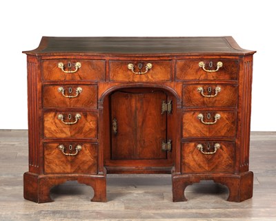 Lot 1484 - A GEORGE III FLAMED MAHOGANY SERPENTINE FRONTED KNEEHOLE DESK