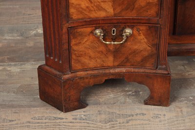 Lot 1484 - A GEORGE III FLAMED MAHOGANY SERPENTINE FRONTED KNEEHOLE DESK