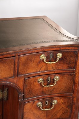 Lot 1484 - A GEORGE III FLAMED MAHOGANY SERPENTINE FRONTED KNEEHOLE DESK