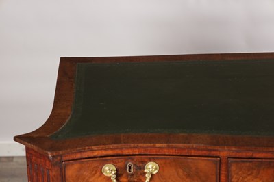 Lot 1484 - A GEORGE III FLAMED MAHOGANY SERPENTINE FRONTED KNEEHOLE DESK