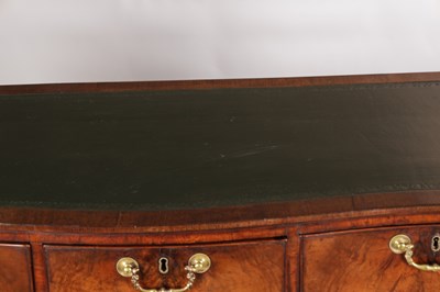 Lot 1484 - A GEORGE III FLAMED MAHOGANY SERPENTINE FRONTED KNEEHOLE DESK