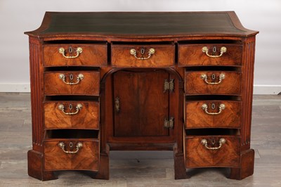 Lot 1484 - A GEORGE III FLAMED MAHOGANY SERPENTINE FRONTED KNEEHOLE DESK