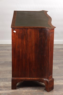 Lot 1484 - A GEORGE III FLAMED MAHOGANY SERPENTINE FRONTED KNEEHOLE DESK