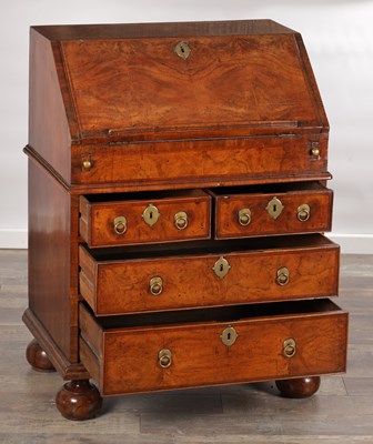 Lot 1674 - A WILLIAM AND MARY HERRINGBONE INLAID FIGURED WALNUT BUREAU OF SMALL SIZE
