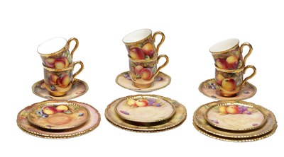 Lot 602 - A SET OF SIX 20TH CENTURY ROYAL WORCESTER PORCELAIN FRUIT-PAINTED TEA CUPS AND SAUCERS WITH SIDE PLATES