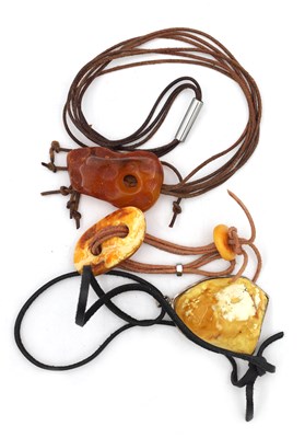 Lot 254 - A COLLECTION OF THREE AMBER NECKLACES