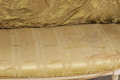 Lot 1584 - A GEORGE III PARCEL GILT AND PAINTED HEPPLEWHITE STYLE THREE SEATER SETTEE