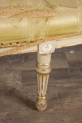 Lot 1584 - A GEORGE III PARCEL GILT AND PAINTED HEPPLEWHITE STYLE THREE SEATER SETTEE